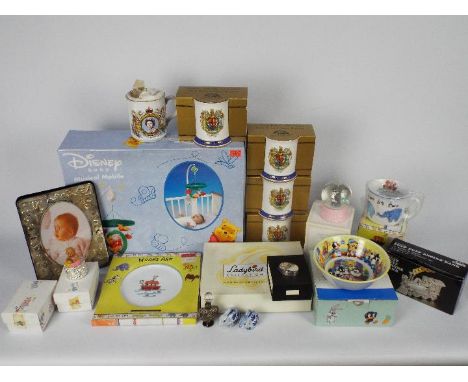 A collection of predominantly boxed items to include ceramics, Disney Winnie The Pooh musical mobile, money bank, snow globe 