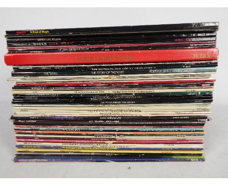 A collection of 12" vinyl records to include Queen, John Lennon, The Animals, The Who, David Bowie, ELO and similar.Condition