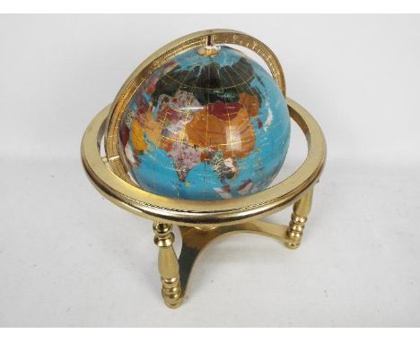 A brass and gemstone terrestrial globe, 32 cm (h).
