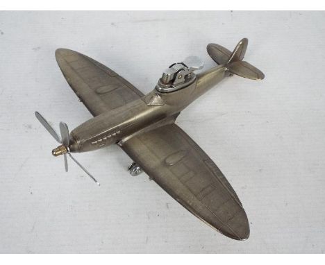 A novelty table lighter in the form of a Supermarine Spitfire Mk IX, 20 cm (l).