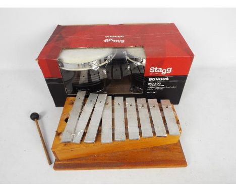 A boxed pair of Stagg Bongos and a vintage glockenspiel. [2]