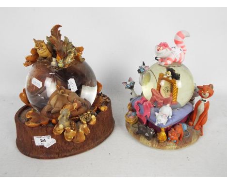 Disney - Two Disney snow globes comprising Bambi and The Aristocats, approximately 24 cm (h). [2]Condition Report: Bambi exam