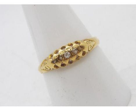 An 18ct yellow gold stone set ring (2 stones deficient), size R, approximately 1.9 grams.