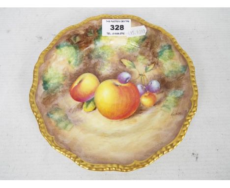 A Royal Worcester fruit decorated plate by Alan Telford, having shaped gilt rim and depicting apples and grapes reserved agai