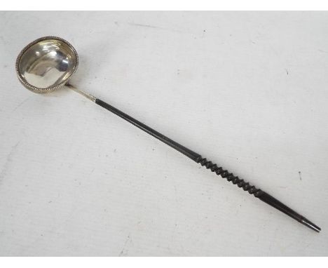 A silver toddy ladle, 35 cm (l)Condition Report: Generally good condition, a couple of small dents to the bowl, some surface 