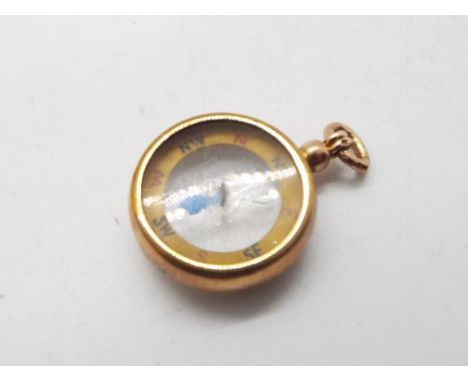 An antique 9ct rose gold cased pocket or fob compass, 16 grams all in.Condition Report: Generally good condition, some dentin