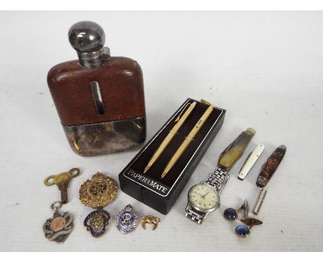 A mixed lot of collectables to include white metal hip flask, penknives, wrist watch, late Victorian silver fob / medal and s