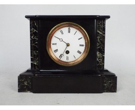A black slate and marble mantel clock of architectural form, Roman numerals to a white dial, 21 cm (h).