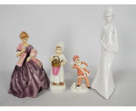 Royal Worcester - Three Freda Doughty designed figures comprising First Dance, Polly Put The Kettle On and Snowball, largest 