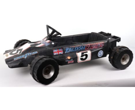 Raleigh Monza racing child’s plastic body pedal car, with stickers and in fair condition, approx. length 38inch (97cm),1 item