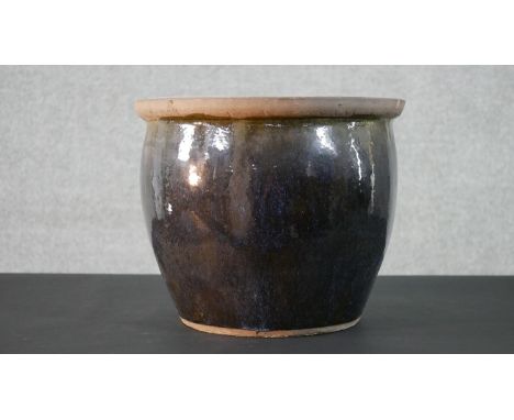 An art pottery drip glaze planter. Diam.39cm 