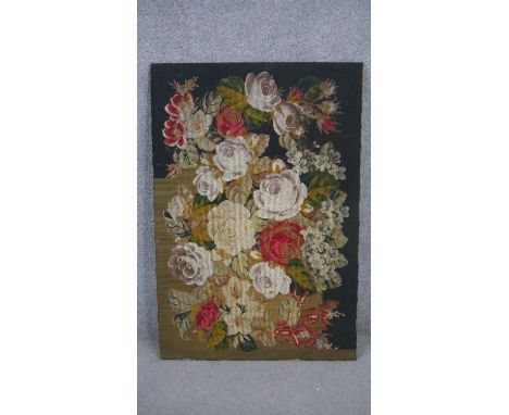 An early 20th century tapestry panel with roses and other flowers. H.115 W.77cm 