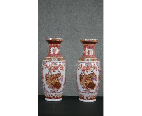 A pair of Chinese transfer printed and gilded ceramic vases, decorated with peacocks and flowers. H.62 W.25cm 