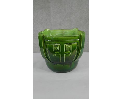 A large 19th century Bretby pottery green glaze planter with geometric design, impressed makers mark to base. H.33 W.40cm 