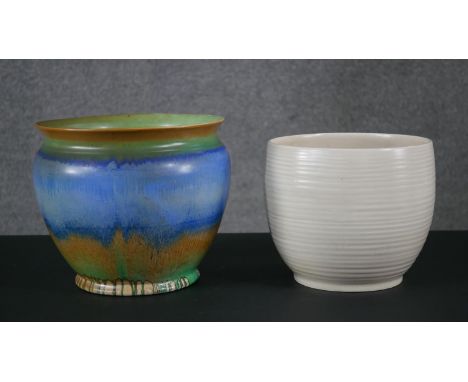 A large hand painted Shell blue, green and brown planter along with a Clarice Cliff cream glaze ridged planter. Makers mark t