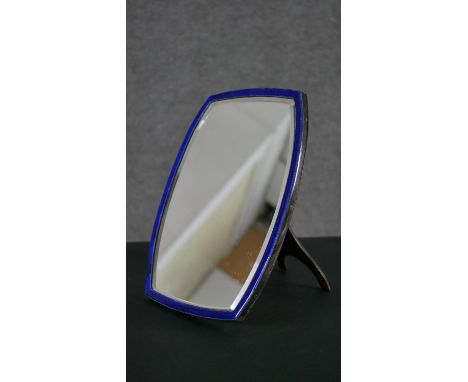 An Art Deco silver and blue enamel framed dressing table mirror with easel back. Hallmarked: H.32 W.24cm 