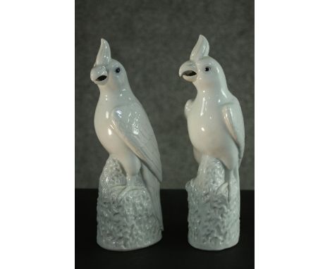 Two Chinese blanc de chine ceramic parrots on rocky bases. Impressed character mark to the base. H.30cm. 