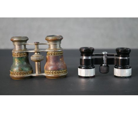 Two pairs of opera glasses one with mother of pearl inlaid detailing. H.8 W.11 D.7cm 