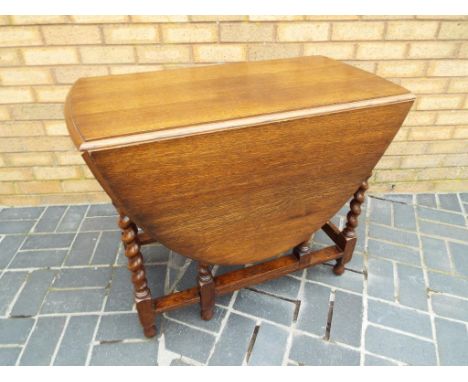 A good quality oak drop leaf barley twist gate leg table 73 cm (h) x 132 cm x 89 cm