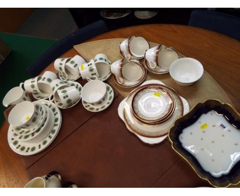 Two ceramic part tea services to include a quantity of approximately 33 pieces of Queen Anne and 20 pieces of Royal Grafton a