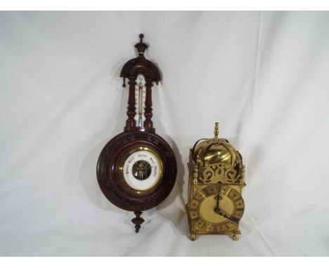 A brass Smiths mantle clock inscribed Smiths Industries Ltd Clock and Watch Division and a wall mounted barometer (2)