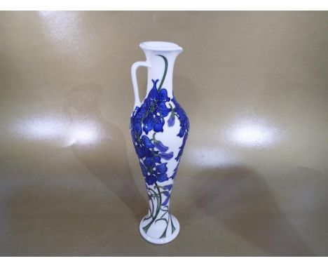 Moorcroft - a Moorcroft jug decorated in the Delphinium pattern, approximate height 32 cm (h). Estimate £130 - £160