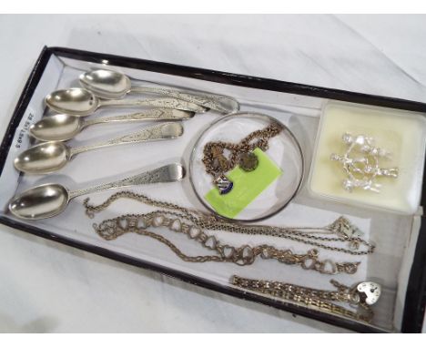 A collection of silver to include a George VI silver hallmarked set of five teaspoons, Exeter assay marks, a silver bangle an