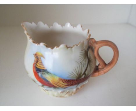 Royal Worcester (for Locke & Co) - a blush ivory cream jug hand painted with depiction of an exotic bird, signed J Lewis, 6.7