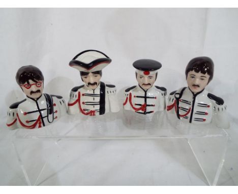 Lorna Bailey - a set of four novelty Beatle ceramic busts. Estimate £40 - £60 (4)