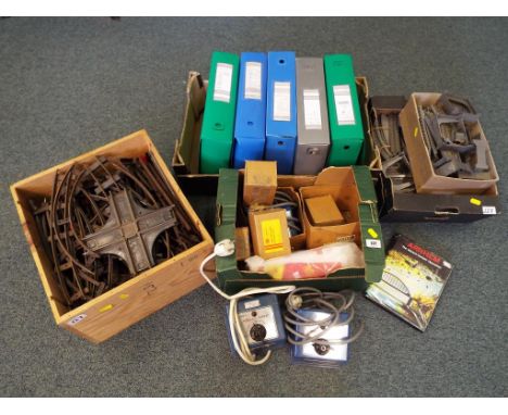 A good mixed lot of railway track, transformers and a quantity of Marklin catalogues 1975 - 1981 and 1985 - 1994, Markin leaf