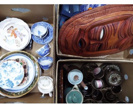 A mixed lot to include ceramic tableware, teacups, saucers, commemorative plates, a wooden African mask, an Edinburgh crystal