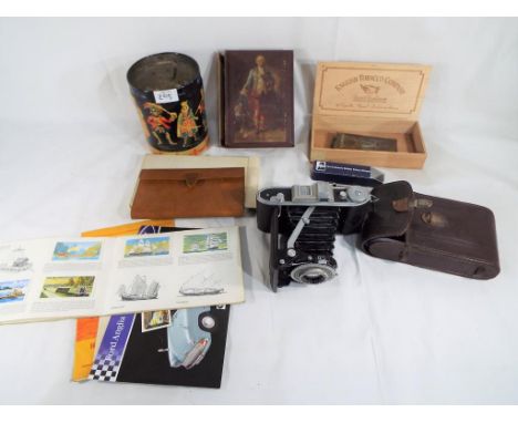 A good mixed lot to include a vintage Agfa Billy record 1 camera in leather case, an authentic police whistle, a Brooke Bond 