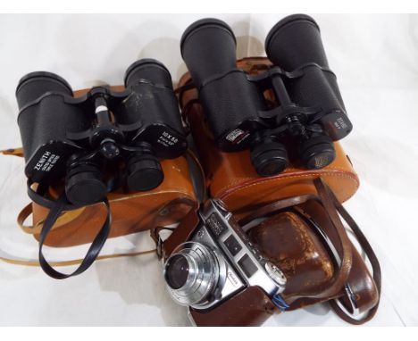 A pair of Denhill deluxe coated optic binoculars No. 67388 20 x 60 zoom, lens covers and protective leather case, a pair of Z