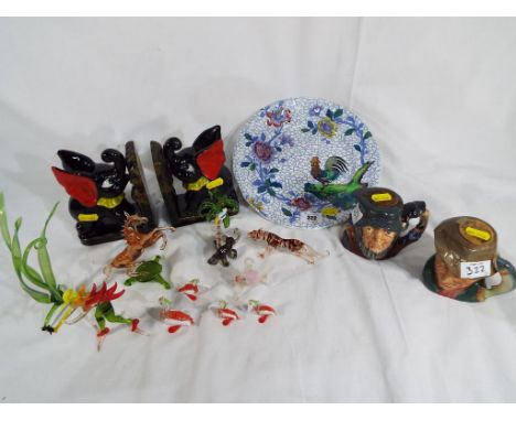 A mixed lot of ceramics to include a Spode plate decorated with flowers and a rooster, two ceramic bookends depicting elephan