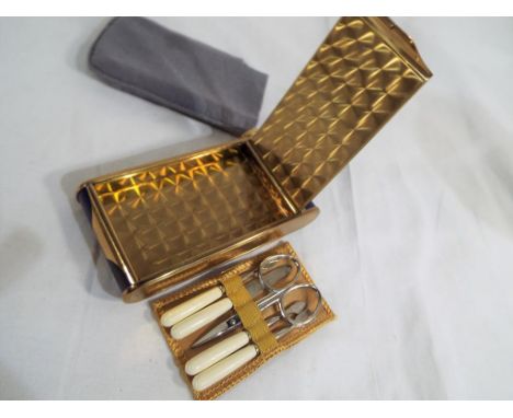 Reuge Ste-Croix - a very good quality art deco Reuge Ste-Croix lady's pocket musical manicure and powder compact set still wi