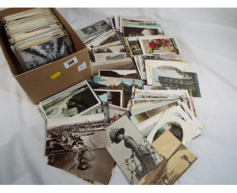 A lot containing in excess of 600 early - mid period UK and foreign topographical postcards with subjects to include real pho