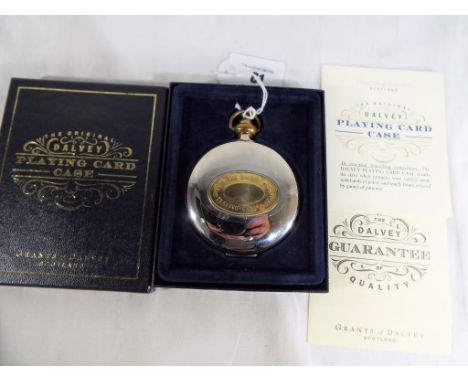 A cased set of Dalvey playing cards in white metal case and presentation box and three paperbacks, A Clockwork Orange by Anth