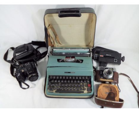 A lot to include an Olivetti portable typewriter, cased, a Fujifilm Finepix S7000 digital camera, cased, a Voigtlander colour