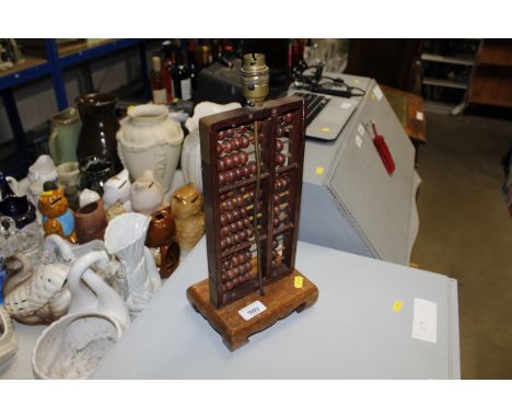 An Oriental style table lamp in the form of an abacus
