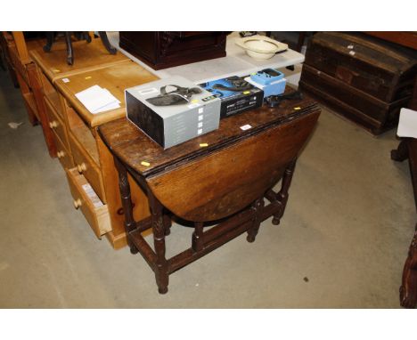 An antique gate leg table fitted single drawer