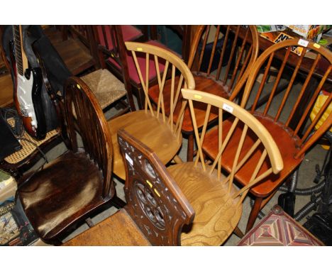 A pair of blonde Ercol stick back kitchen chairs