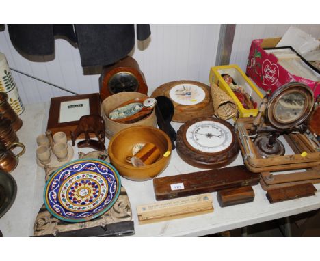A small wooden swing framed mirror, Pelham puppet, a wooden bread board, mantel clock, barometer and various decorative items