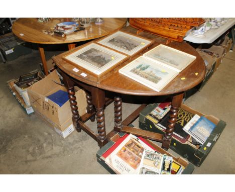 A 1930's oak gate leg barley twist dining table