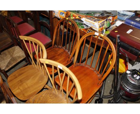 A pair of Ercol stick back kitchen chairs