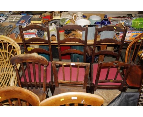 Three ladder back dining chairs; a Victorian elm seated kitchen chair; a 19th Century rail back chair and an Art and Crafts d