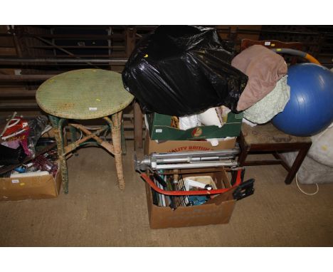 A collection of cushions and pillows and a box of tools