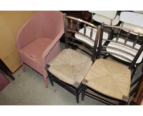A pair of late 19th early 20th Century bobbin back string and rush seated chairs and a Lloyd Loom chair AF
