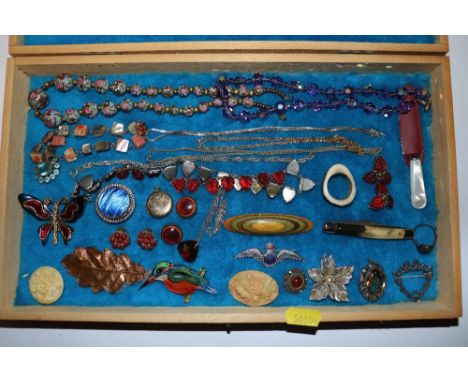 An embroidered trinket box and contents of various beads; brooches etc