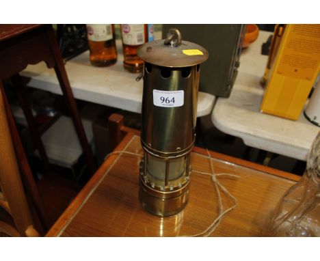 A brass miner's lamp