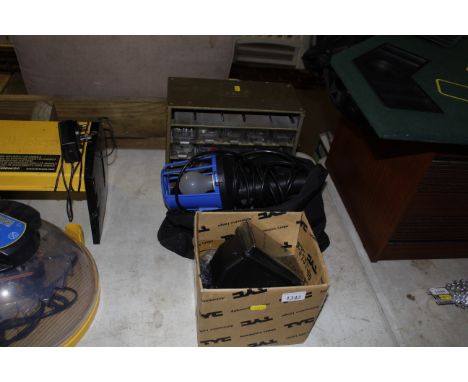 A metal multi drawer chest; an inspection light; another light and various tools